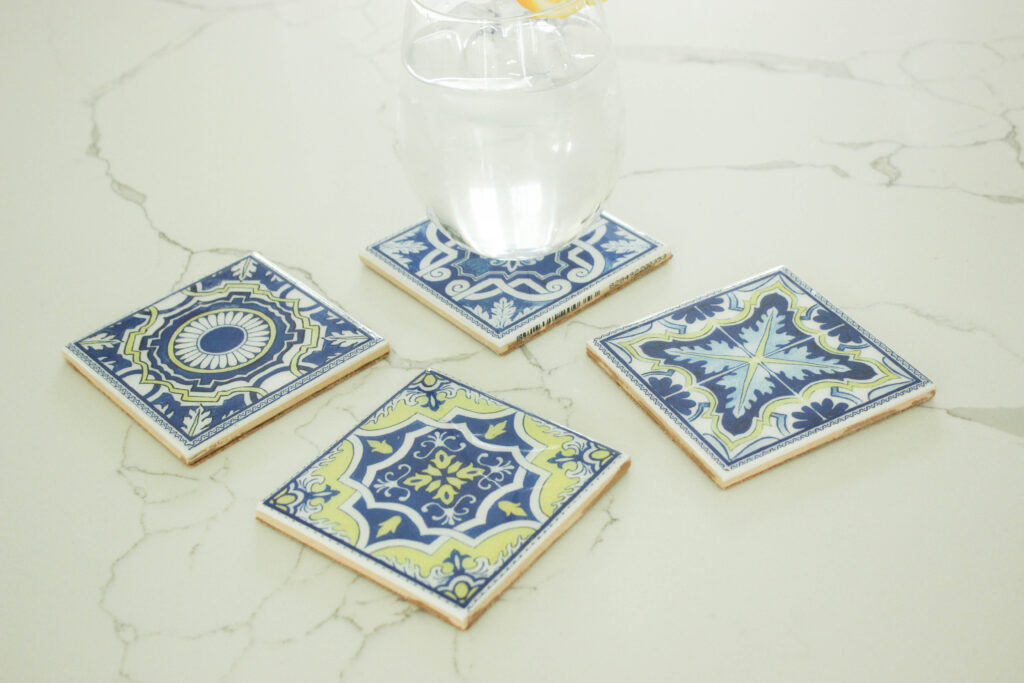 Adding cork backing to painted tiles to make coasters 